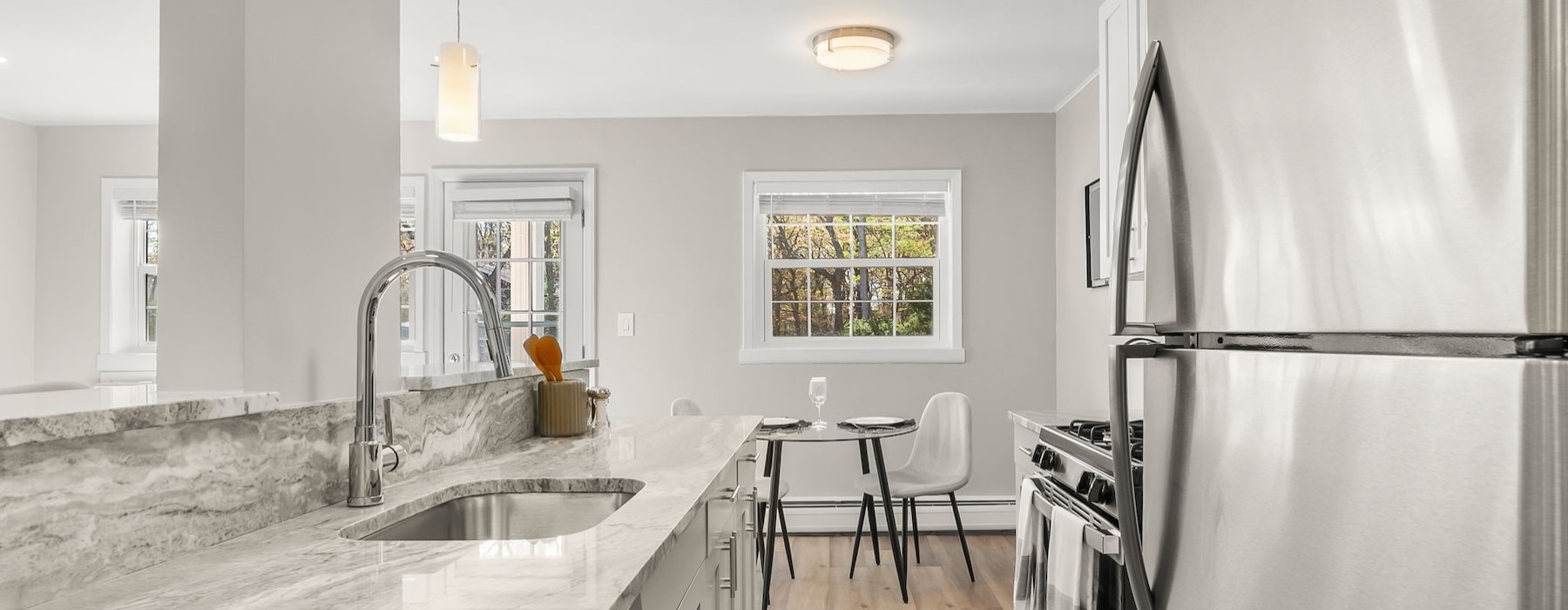 a kitchen with a marble countertop