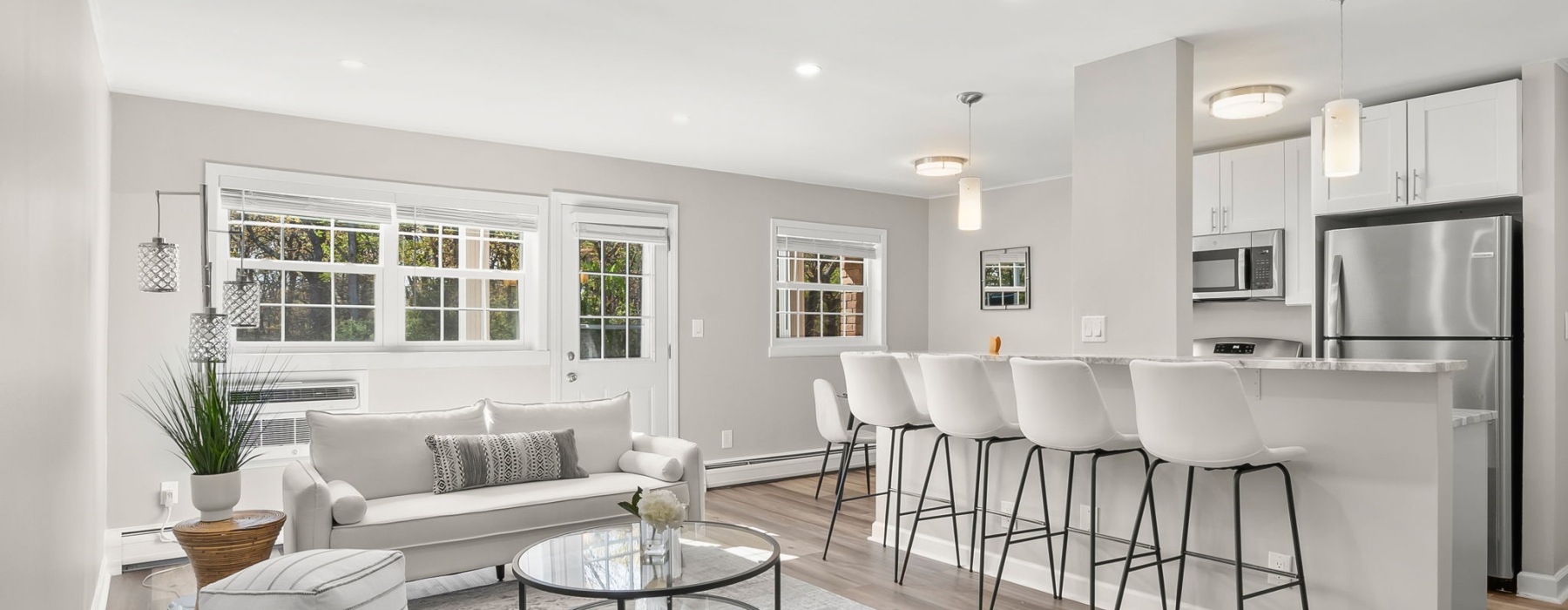 a living room with a couch and chairs