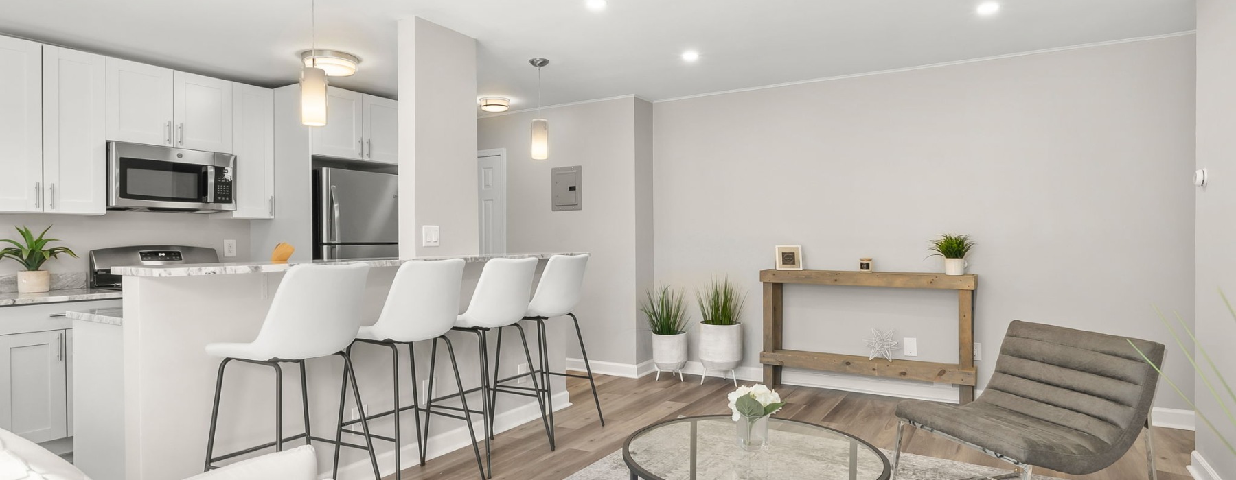 a living room with tables and chairs